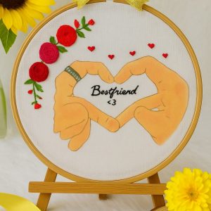 Thus design showing hand- heart best friend gesture with floral details.