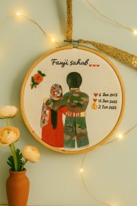 Custom couple handmade embroidery designs featuring a fauji groom and bride with floral details and dates